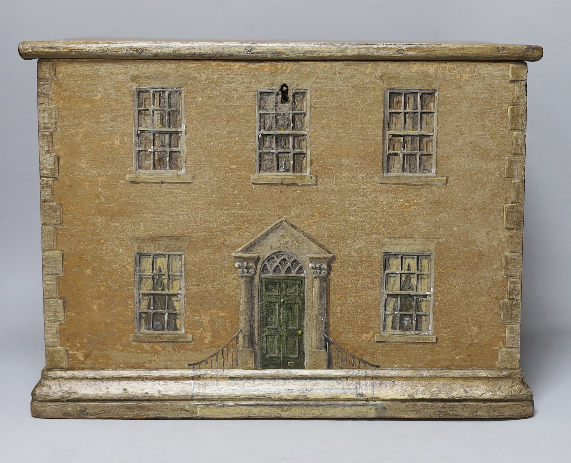 A 19th century pine box overpainted as an earlier Georgian house, painted on three sides, 42cm x 31cm high